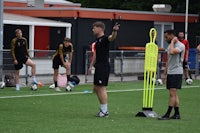 a group of soccer players on a soccer field